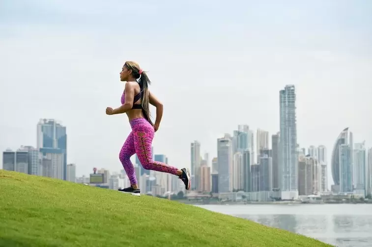 The girl follows the rules of breathing, depending on the running technique